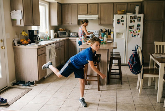 kid practicing pitching motion in kitchen