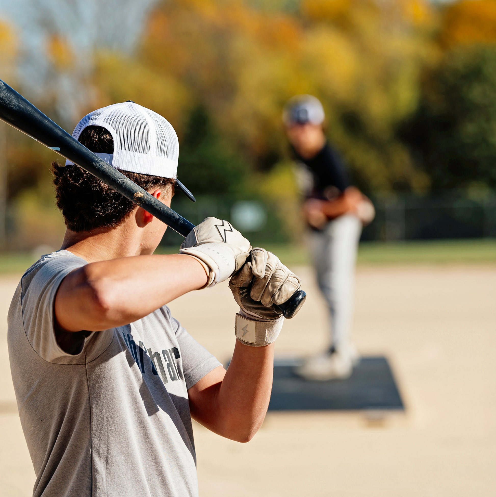 Athletes training with some live at bats and pitching off a Prospect 10-Inch Modular Pitching Mound.