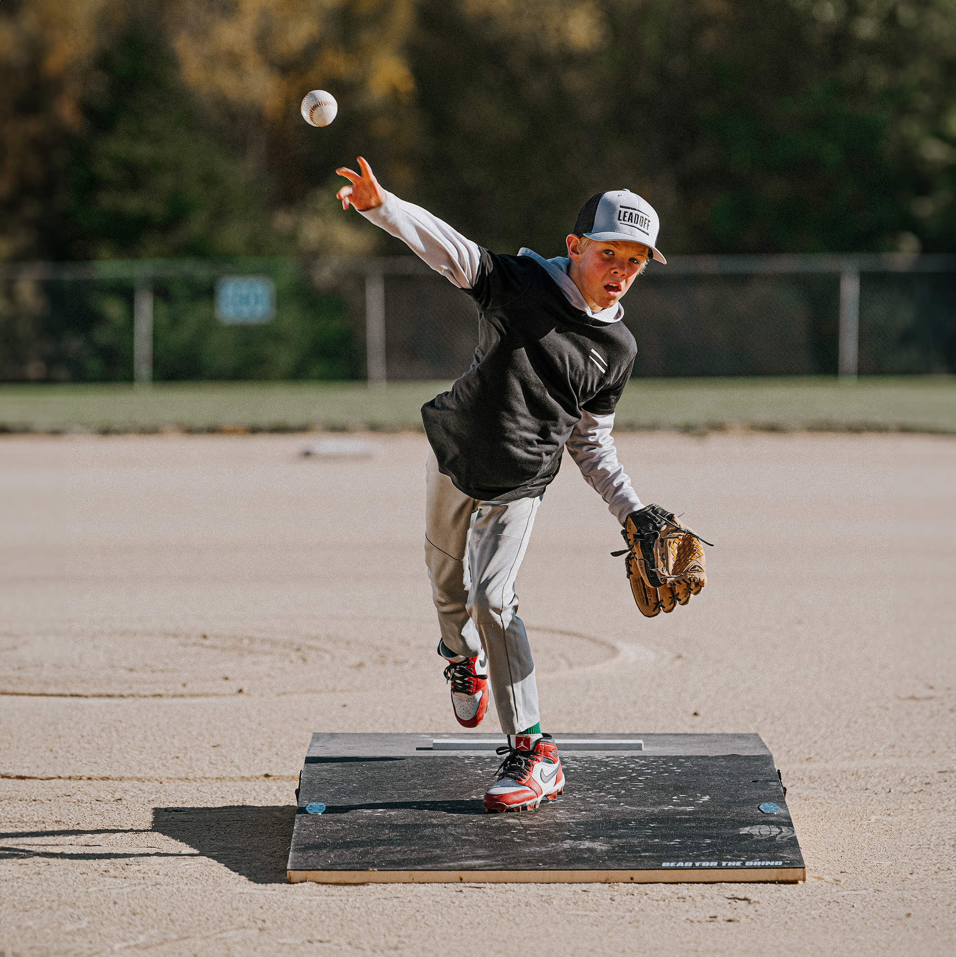 Up and coming young pitcher training on a FirstStrike Wheeled 6-Inch portable Pitching Mound.
