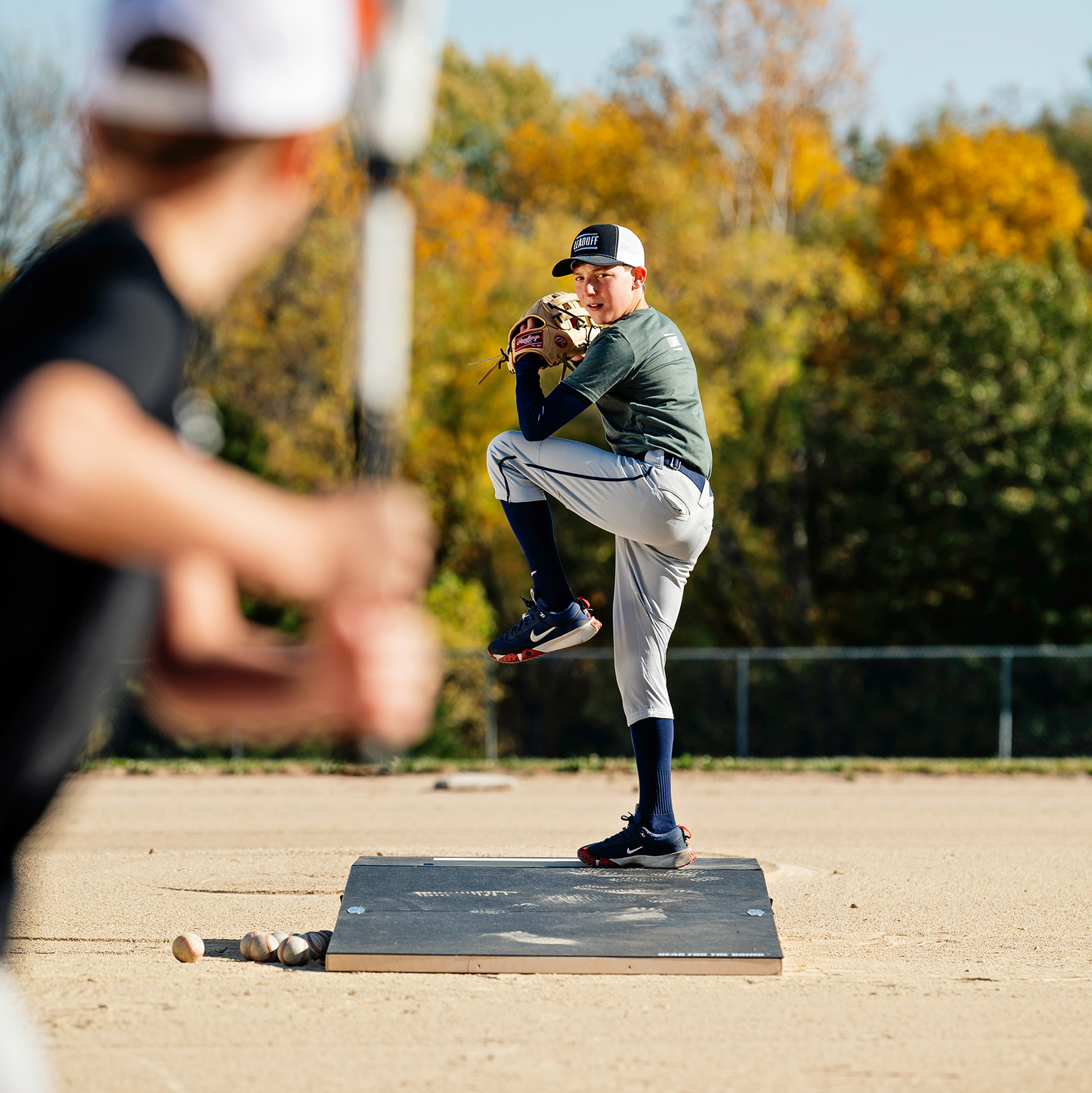 Athletes training with our Velocity Wheeled 8-Inch Portable Pitching mound for a realistic game feel.
